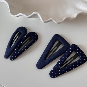 Navy blue polka dot and solid fabric BB hair clips set in teardrop and triangle shapes