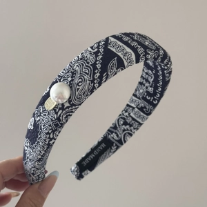 Navy blue paisley hair scrunchie with large white pearl and handmade metal tag detail