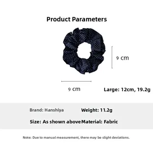 Comparaison détaillée des chouchous en tissu à pois bleu marine de 9cm et 12cm