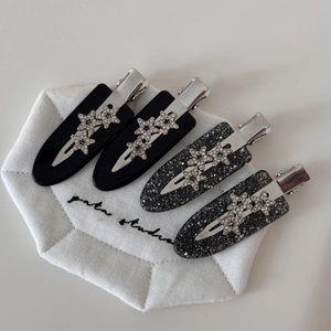 Sparkling star acetate hair clips set with silver rhinestones on black base for women