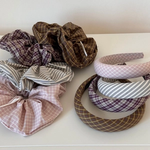 Blue and pink plaid fabric scrunchies and headbands collection on white background