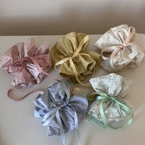 Polka dot drawstring hair scrunchies in five pastel colors with ribbon bow detailing