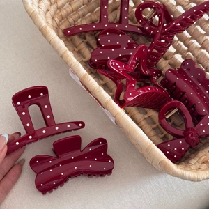 Red hair claw clips set with white polka dots in heart and star shapes for women