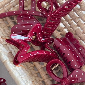 Burgundy hair claw clip set with white polka dots in star, heart, and wave shapes