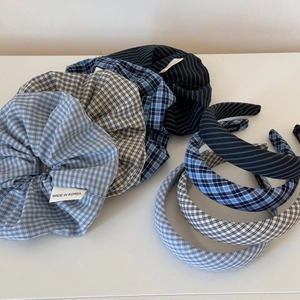 Detail view of Korean style blue and gray plaid fabric scrunchies and headbands collection
