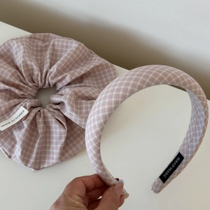 Detail showing pink gingham scrunchie and padded headband set with handmade labels