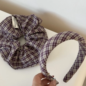 Detail showing checkered hair scrunchie set with blue plaid fabric and Made in Korea tag