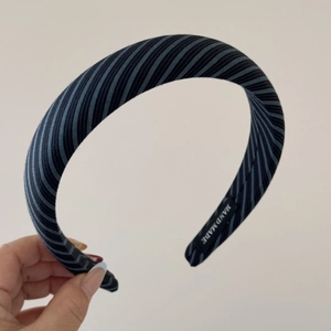 Detailed shot of sea salt blue striped handmade headband with premium fabric texture