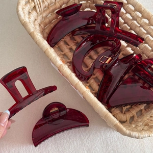 Set of semi-transparent deep red acrylic hair claws in various geometric shapes