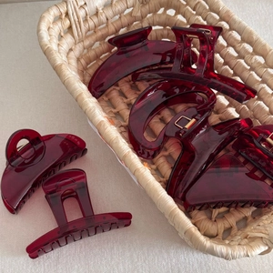 Elegant set of transparent wine red resin hair claws in various geometric shapes