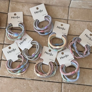Colorful macaron elastic hair bands set with cute oval beads on elegant paper cards
