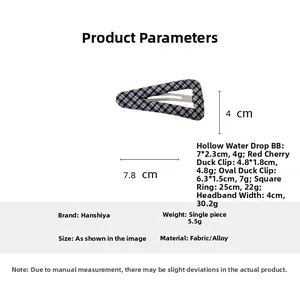Detail view of navy blue plaid fabric hair clip with 7.8cm size measurements