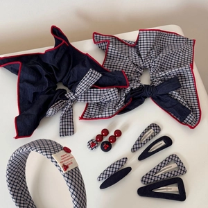 Navy blue plaid hair clip and headband set with red cherry accents and fabric bow ties