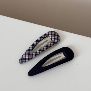 Detail view of navy blue plaid and solid blue fabric teardrop BB hair clips set