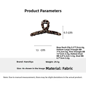Detailed size and weight chart for the leopard print hair claw clip in soft fabric material