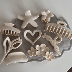 Creamy beige starfish and flower hair claw clips set with marble texture finish