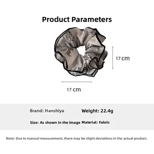 Detail view of jacquard hair scrunchie showing 17cm diameter and 22.4g weight specifications