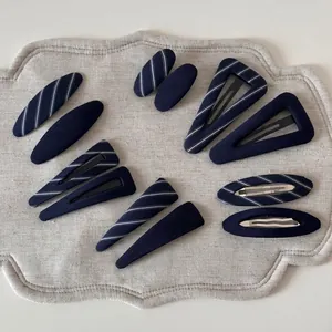 12-piece navy blue striped geometric hair clip set including oval and triangle shapes