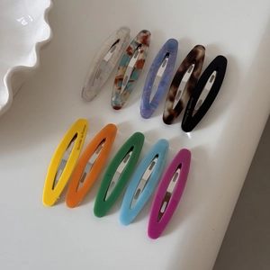 Set of 10 colorful tortoiseshell and solid acetate oval hair clips with metal bases