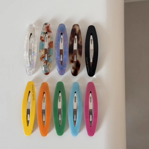 Top view of 10 French vintage acetate hair clips with marble texture and solid colors