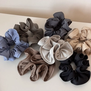 Set of seven large solid color scrunchies in minimalist textures and earthy tones