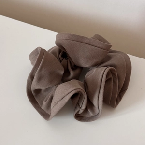 Close-up of coffee brown scrunchie with layered ruffles and twill fabric texture