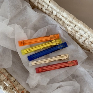 Detailed set of five translucent acetate hair clips with gold handmade lettering