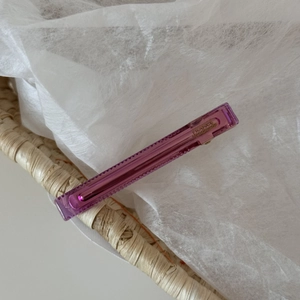 Detail of purple acetate hair clip with gold metal clamp and France Handmade text
