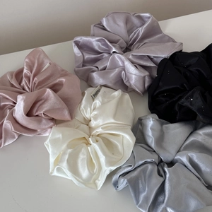 5-piece set of shimmering satin scrunchies in pink, lavender, black, white, and silver grey