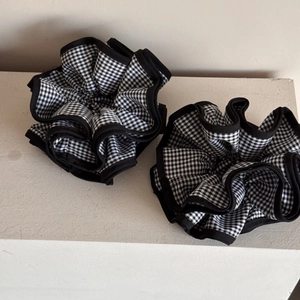 Set of two black and white checkered oversized hair scrunchies with black ruffled edges