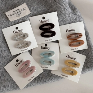 Detailed set of six oval acetate hair clips in Morandi colors on display cards