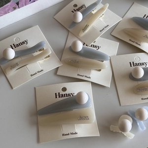Blue and white pearl ball hair clips set for women displayed on elegant presentation cards