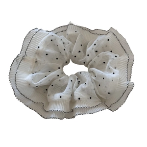 Double-layered pleated white chiffon scrunchie with black polka dots and ruffled edges