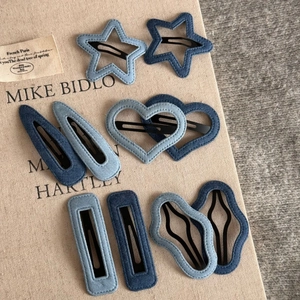 Denim fabric BB hair clip set with star and heart shapes in light and dark blue shades