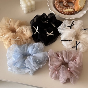 Five ballet-style tulle scrunchies with bow details in assorted pastel colors for women