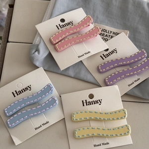Minimalist wavy macaron pastel hair clips in pink, purple, blue, and yellow matte finish