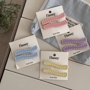 Minimalist wave hairpins set in cream colors with matte finish and stitched detail
