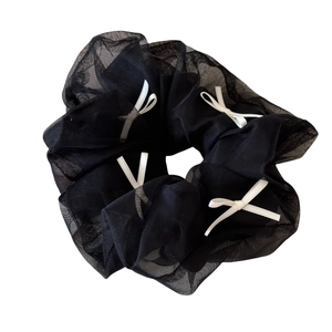Ballet style black mesh scrunchie with white ribbon bows for elegant hair styling
