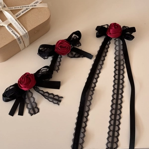 Gothic red rose hair clips with black lace and long tassel ribbons in a gift set