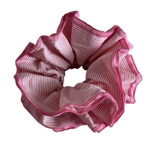 Pink and white striped scrunchie hair tie with ruffled design and reinforced edges