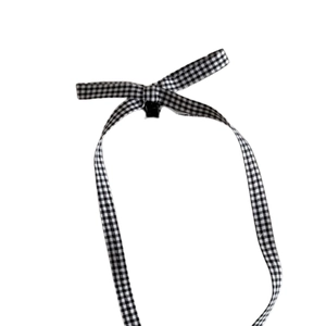 Ballet style black and white gingham ribbon hair clip with a long bow tassel design