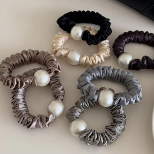 Set of six elegant pearl silk scrunchies in assorted neutral tones for stylish hair styling