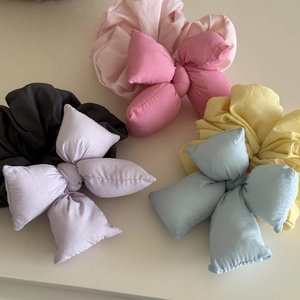 Set of four large pastel bow scrunchies in soft fabric for sweet girl hairstyling