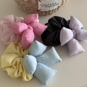 Chic 3D padded bow scrunchies in pastel pink, purple, yellow and blue fabric colors