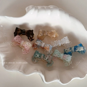 Elegant acetate hollow bow hair clips in multiple marble textures and pastel colors