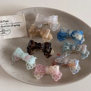 Elegant acetate mini bow hair clip set in assorted marble and tortoiseshell patterns
