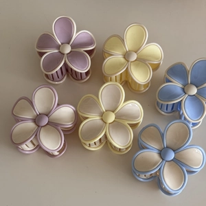 Set of six colorful floral hair claws in pastel shades for versatile hairstyling