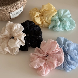 Detailed set of 6 sparkling scrunchies in pastel tones with fine grid texture and rhinestones