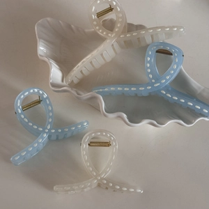 Blue and cream hair claws with dotted ribbon design and golden metal spring in a set