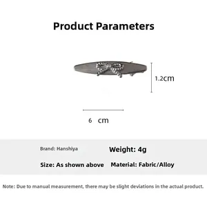 Detail view of silver bow hair clip with dimensions 1.2cm by 6cm and 4g weight